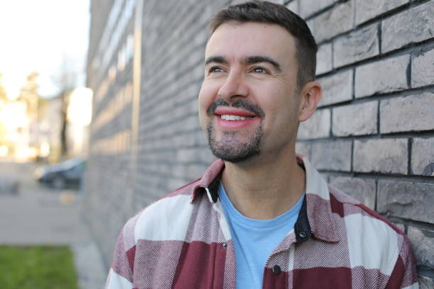 istock Handsome man with a goatee looking away 2187902440