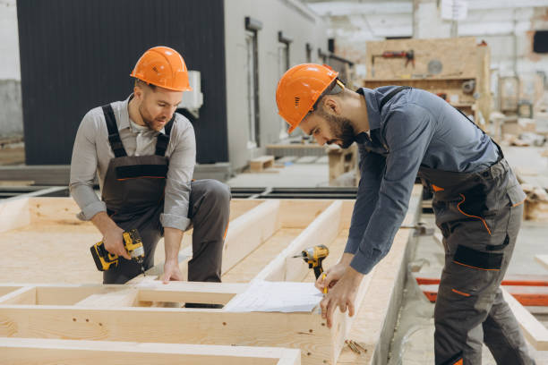 istock Construction workers building wooden frame in factory 2187904053