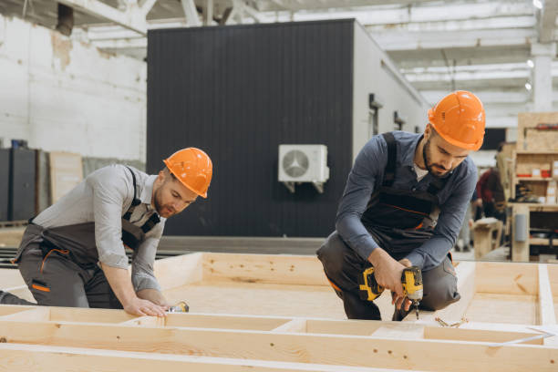 istock Construction workers building wooden frame for modular house in factory 2187904835
