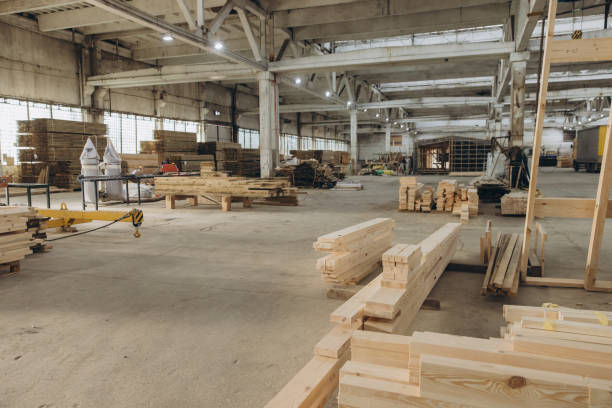 istock Wooden planks lying on floor in large manufacturing workshop 2187904863