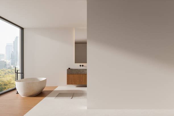 istock Minimalist bathroom with freestanding bathtub, large window, and blank wall space for mockup template. 3D Rendering 2187904950