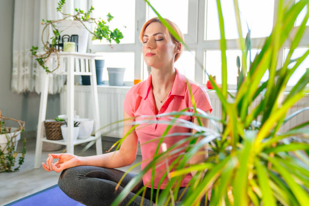 istock Young women practice Yoga at home 2187905460