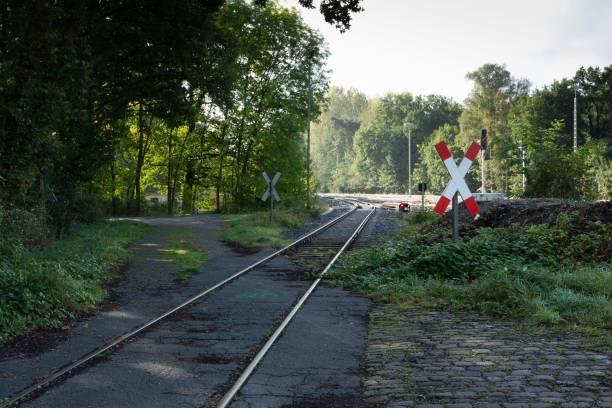 istock Closed Railway Crossing with Red and White Gates 2187912725