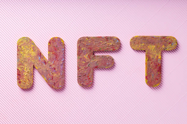 istock NFT Inscription on Pink Background, Minimalistic Crypto Art Concept, Top View 2187913373