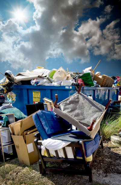 istock Dumpster full of garbages at residential garbage dump area 2187915081