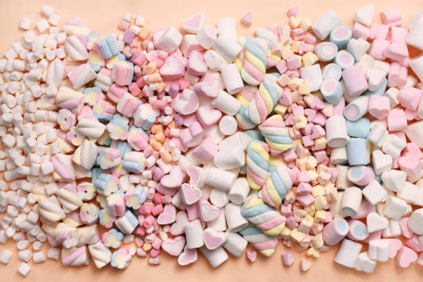 istock Confectionery and sweeties varieties background: light pink and white marshmallows 2187915624