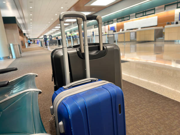 istock Airport indoor check in area with luggages 2187915631