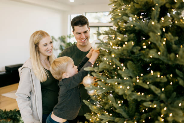 istock Family Putting Up Christmas decorations. 2187915746