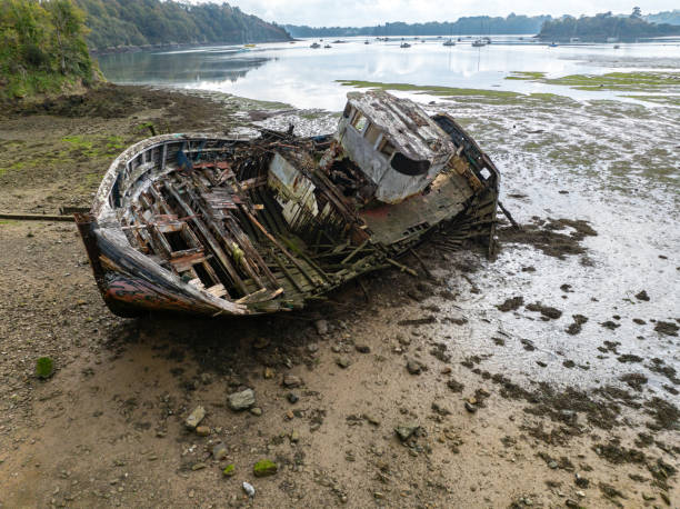 istock wreck of old and rusty boat washed up on the shore 2187916055