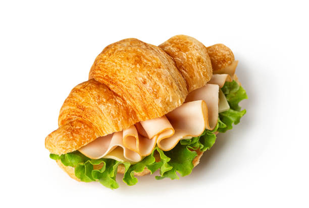 istock Chicken ham, cheese and lettuce croissant or bun isolated on a white background. Modern sandwich concept. 2187916109