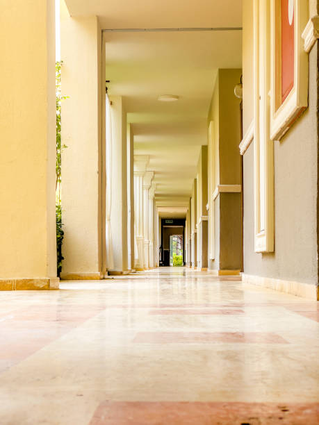 istock Long narrow corridor of concrete building 2187916148