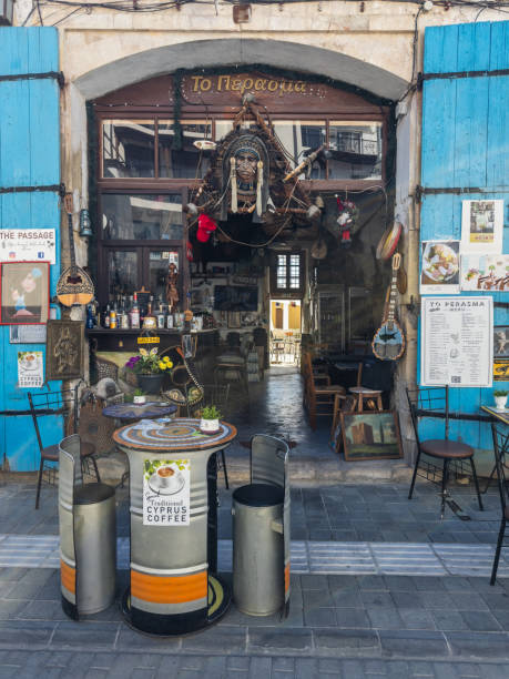 Cozy cafe entrance with artistic decor, offering traditional Cyprus coffee in a rustic and inviting setting in a historic town. Larnaca, Cyprus - October 23, 2024.