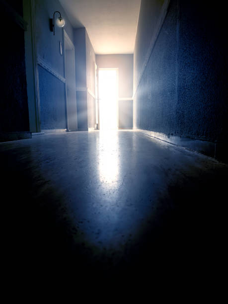 istock Long narrow corridor of concrete building 2187916698