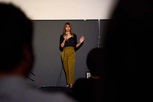 istock Female performer delivering a monologue on stage in an alternative theater with audience 2187921915