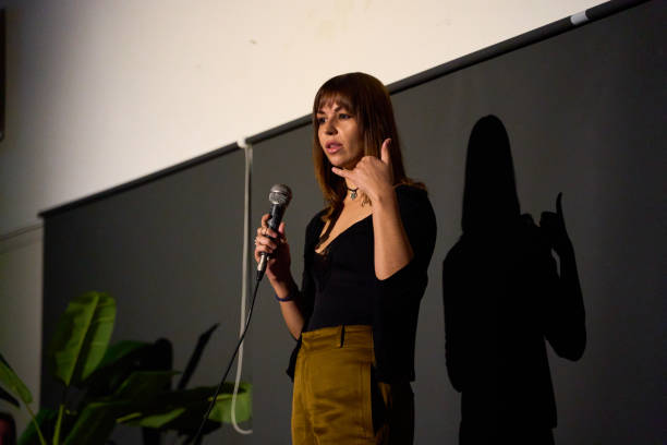 istock Female performer delivering a monologue on stage in an alternative theater with audience 2187921973