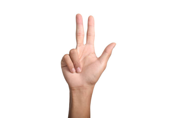 A Caucasian male hand showing the number three gesture isolated on a white background.