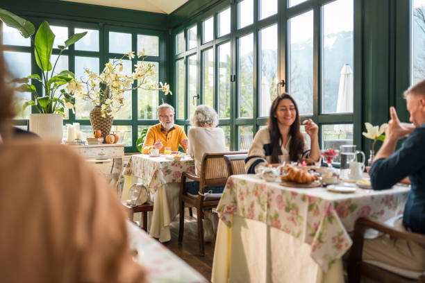 istock Diverse Group Enjoying Breakfast at Boutique Hotel 2187929047