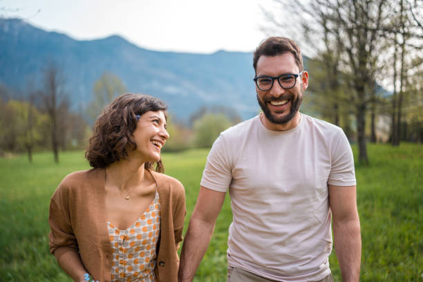 istock Romantic Stroll in Garden Setting for Diverse Couple 2187929085