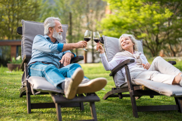 istock Elderly Couple Enjoying Wine Outdoors 2187929105