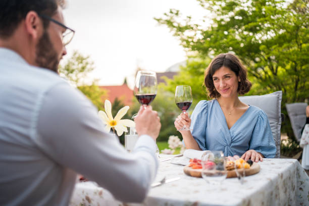 istock Diverse Couple Enjoying Wine on Hotel Terrace 2187929123