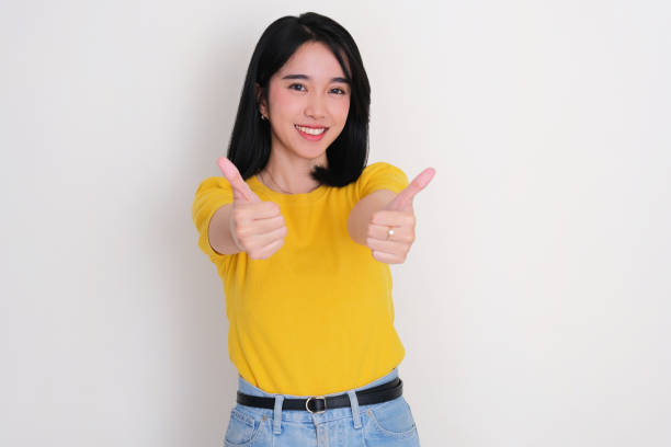 istock A woman give two thumbs up with happy expression 2187933790