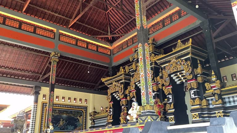 Tana Lot Temple with Golden Artistic Mosaic Decor Inside the Religious Realm in Bali, Indonesia.