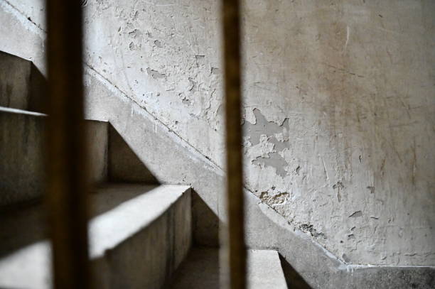 istock Sunlit Stairwell in Abandoned Apartment 2187944335