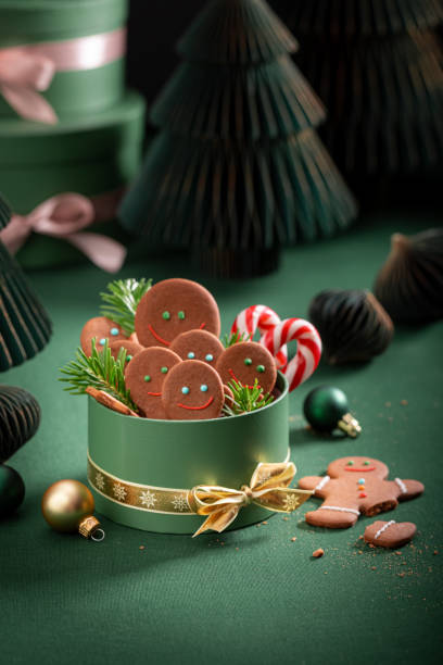 istock Cute Christmas gingerbread mans with Christmas decorations and baubles. 2187944953