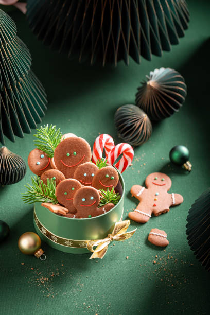 istock Cute Christmas gingerbread mans with candy cane and cookies. 2187944993
