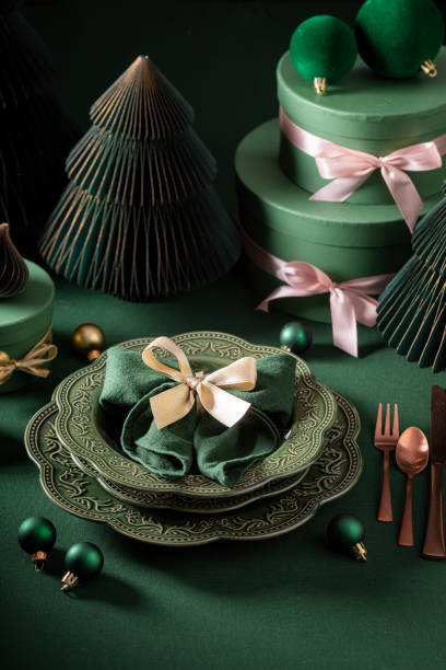istock Modern dark green table set for Christmas with baubles. 2187945501