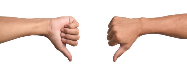 Two male hands showing thumbs down sign isolated on white background