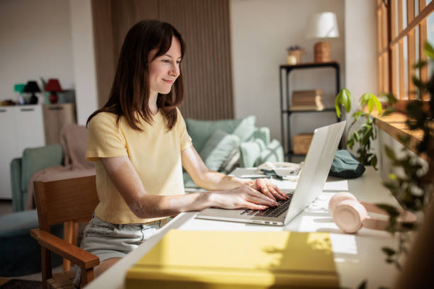 Young woman working from home office