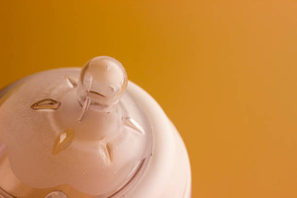 Baby bottle, empty isolated on white background. Studio shot.