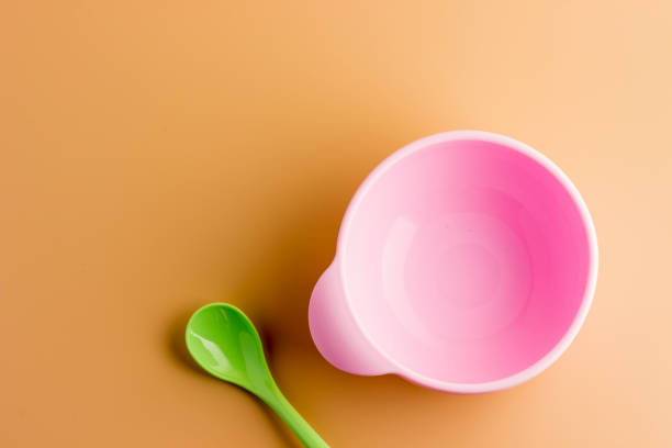 istock pink non-spilling children's plate on a light background 2187952699