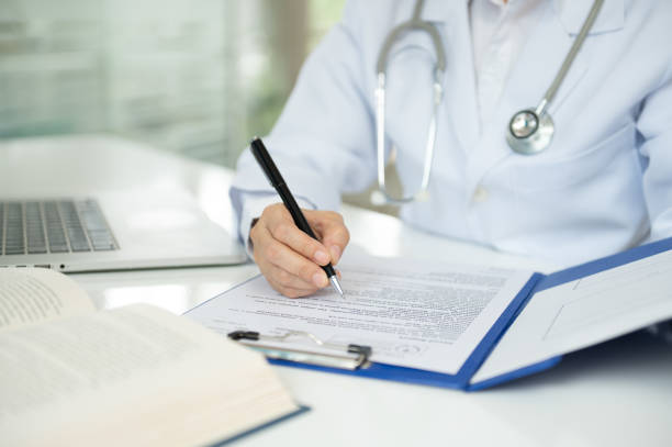 istock medical writer or medical communicator are writing clinical trial documents that describe research results, product use, and other medical information. 2187954471
