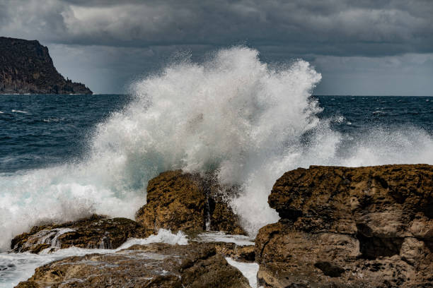 istock Waves crash at Shipsterns Bluff, Tasmania's iconic surfing location 2187955366