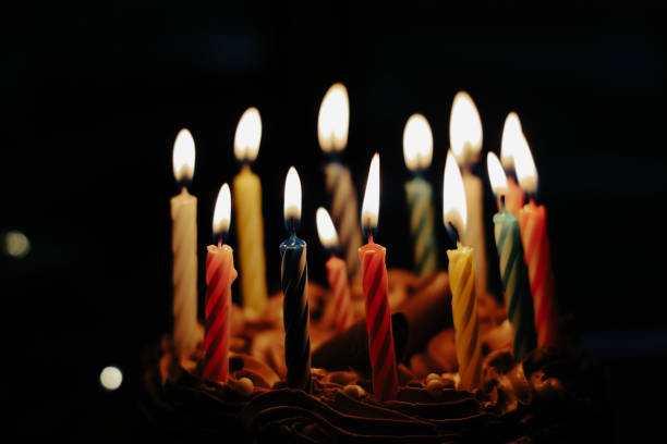 istock Chocolate cake with  colourful candles 2187956160