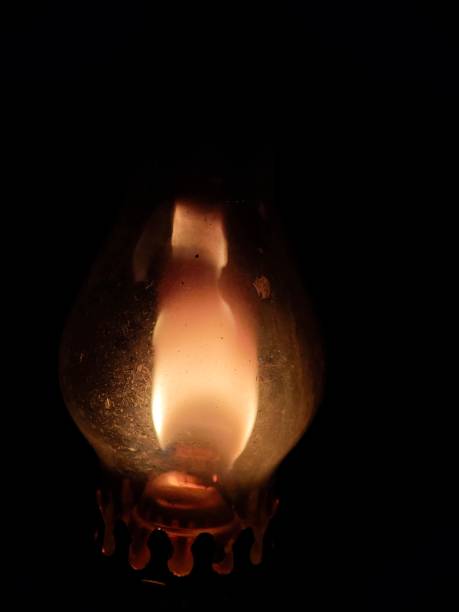 Old lamp in the dark with a beam of light. Halloween concept