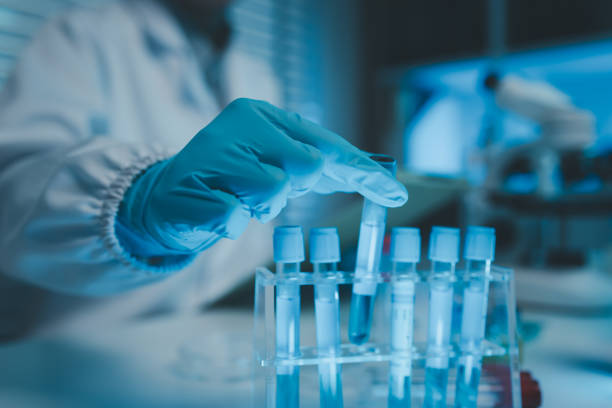 istock a chemist examines a sample of a liquid in a laboratory, a laboratory filled with scientific experiment equipment, microscope, female scientist, female chemist, researcher is searching for scientific 2187961994