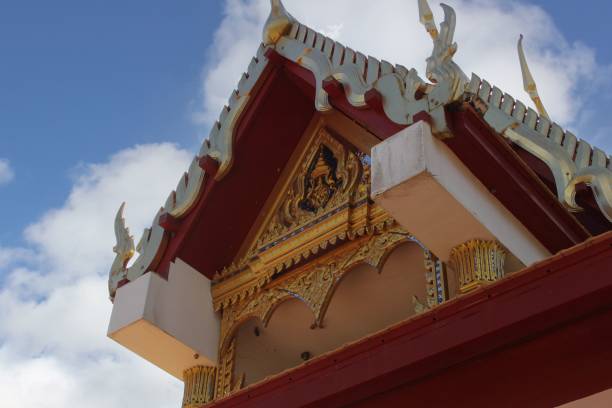 istock Ornate Thai temple rooftop with intricate gold details. 2187962739