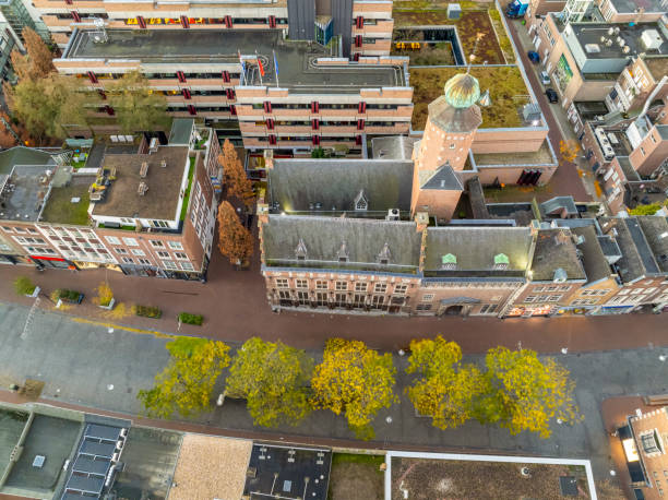 Trees and bushes in fall colors in the city of Nijmegen, The Netherlands during an autumn morning seen from above.