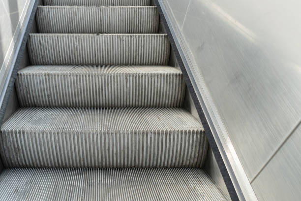 istock Escalator steps, moving staircase, empty metro elevator, electric stairway, metallic moving stairs 2187964157