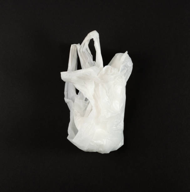 istock White Plastic Bags on Black Background, Crumpled Plastic Bag after Shopping, Cellophane Packaging Waste 2187964177
