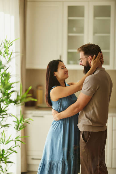 istock Happy couple in love talking at home. 2187967785