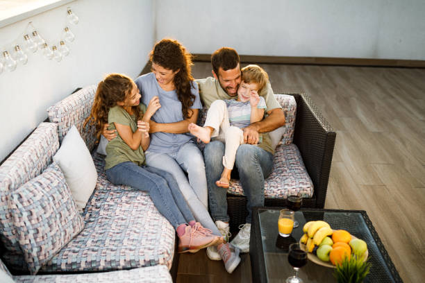 istock Happy family having fun on a patio. 2187969037