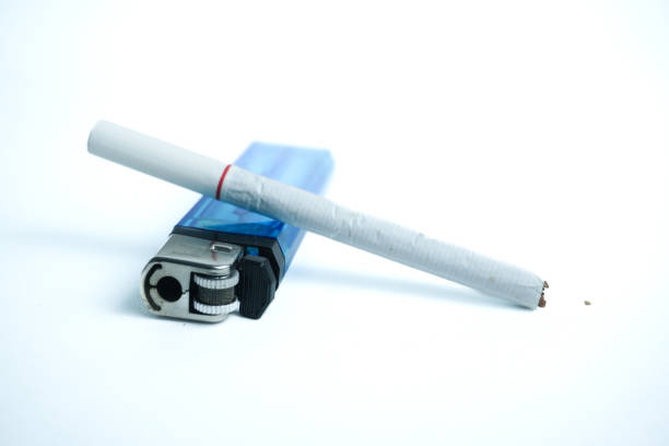 istock cigarette, and a steel gas lighter. isolated on white 2187971194