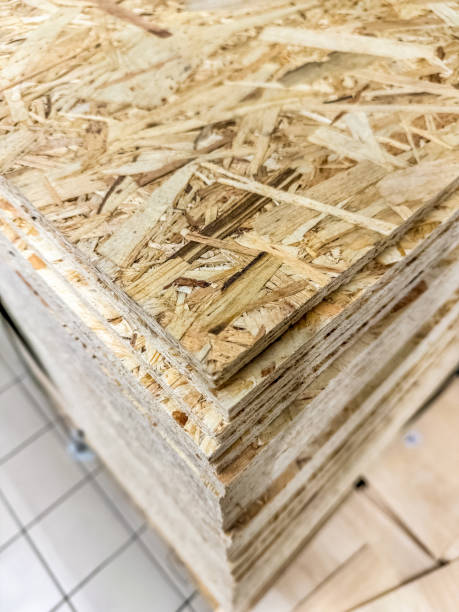 istock Close-up view of stacked oriented strand board OSB wood sheets for construction 2187972398