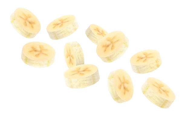 istock Banana background. Flying peeled banana slices. Unfocused and blurry effect. Can be used for wallpaper, banner, poster, print, fabric, wrapping paper. Realistic 3d vector illustration 2187974289
