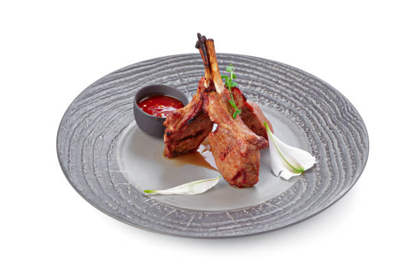 istock Grilled beef steak on grey plate isolated on white 2187976340