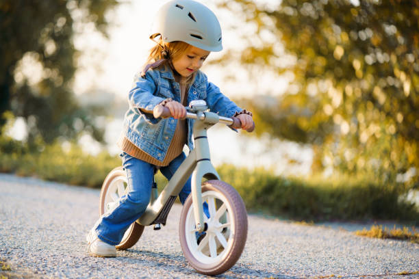 istock Girl learning how to ride a bicycle 2187976892
